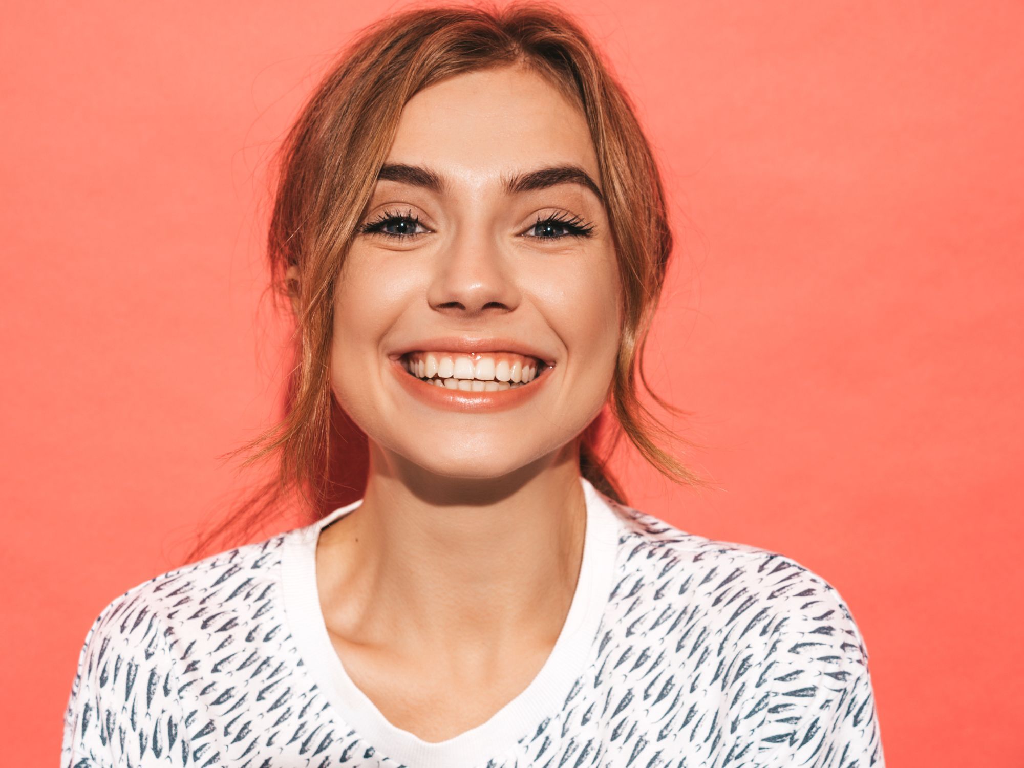 group of young adults smiling and laughing