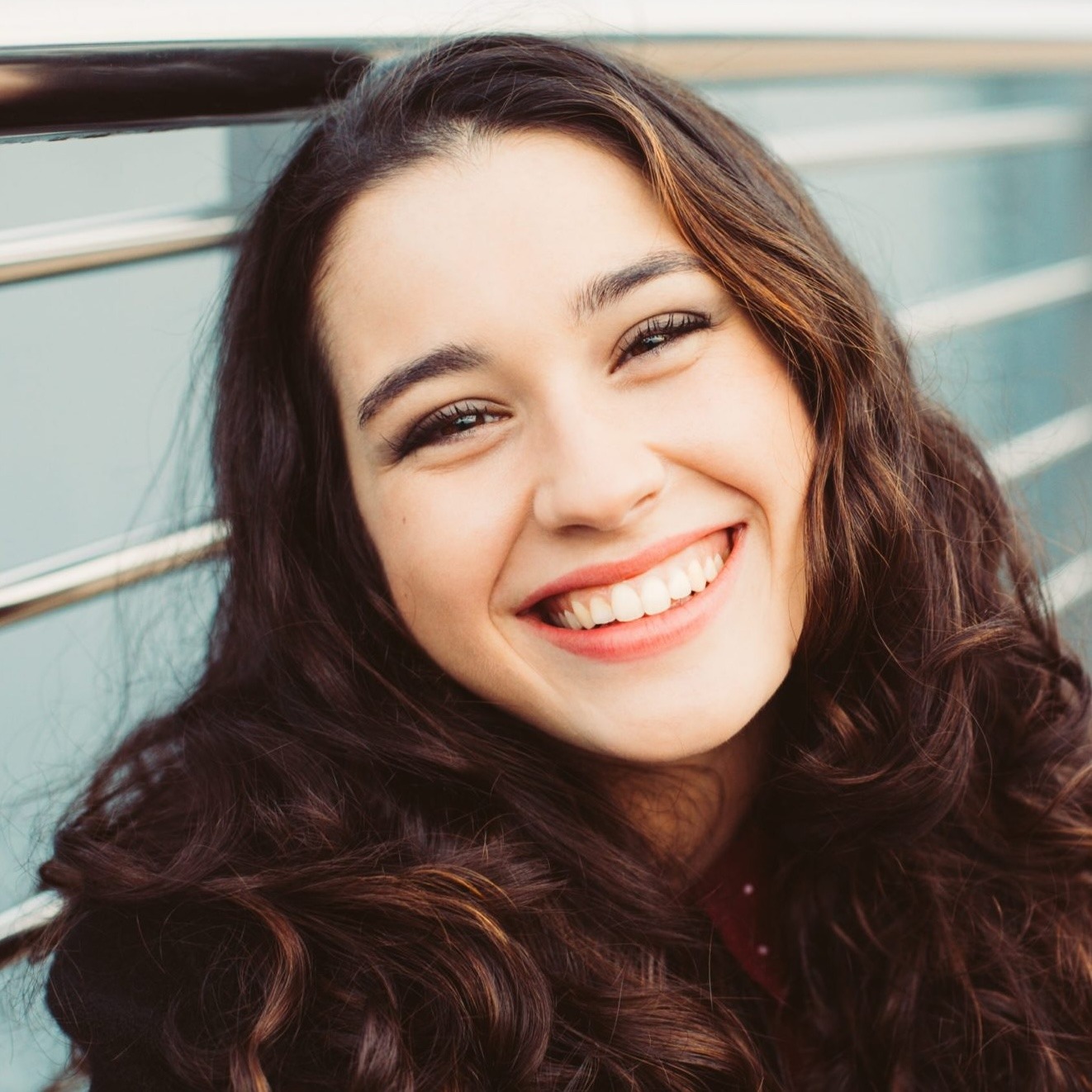 group of young adults smiling and laughing
