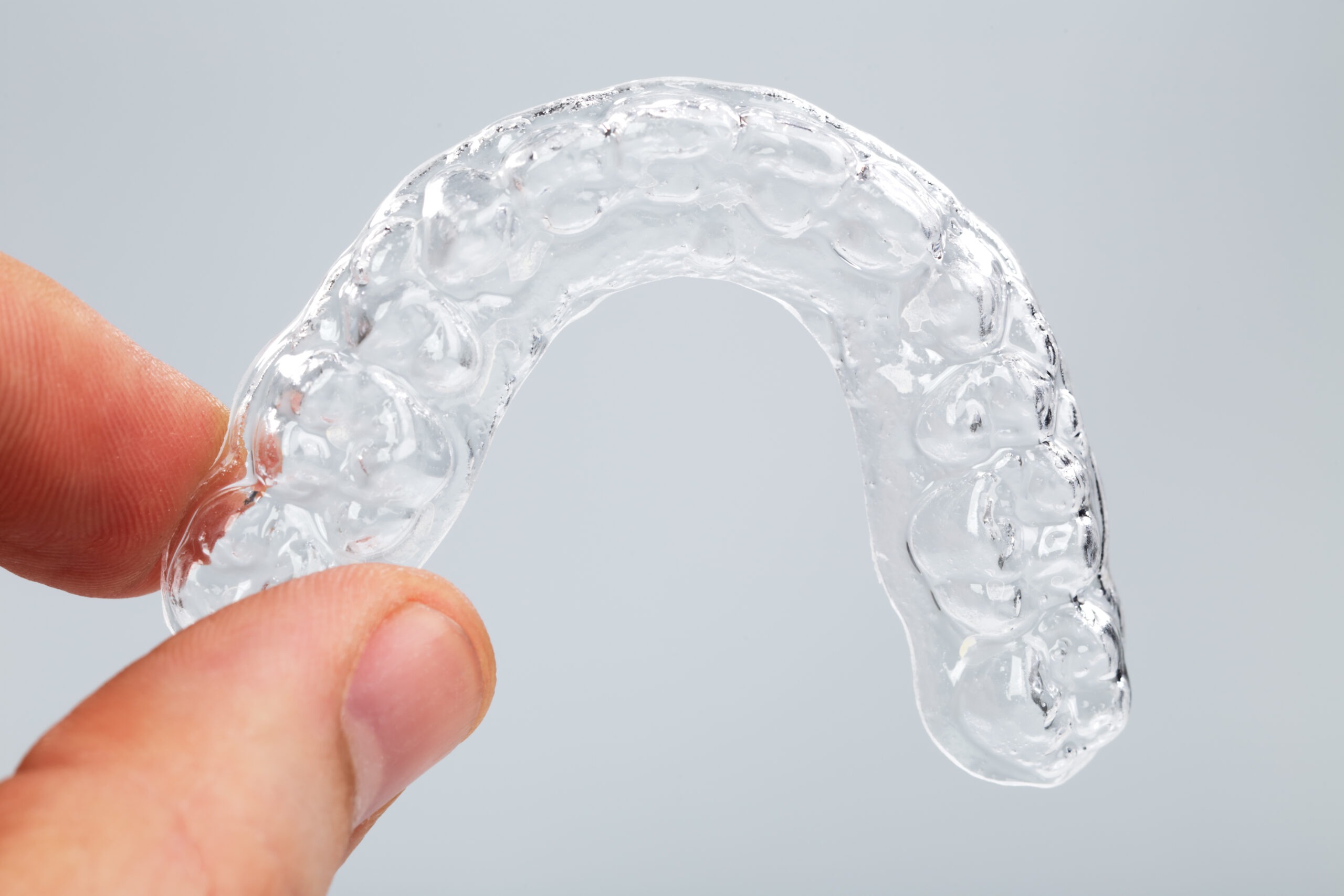 Hand,Holding,A,Translucent,Upper,Essix,Retainer