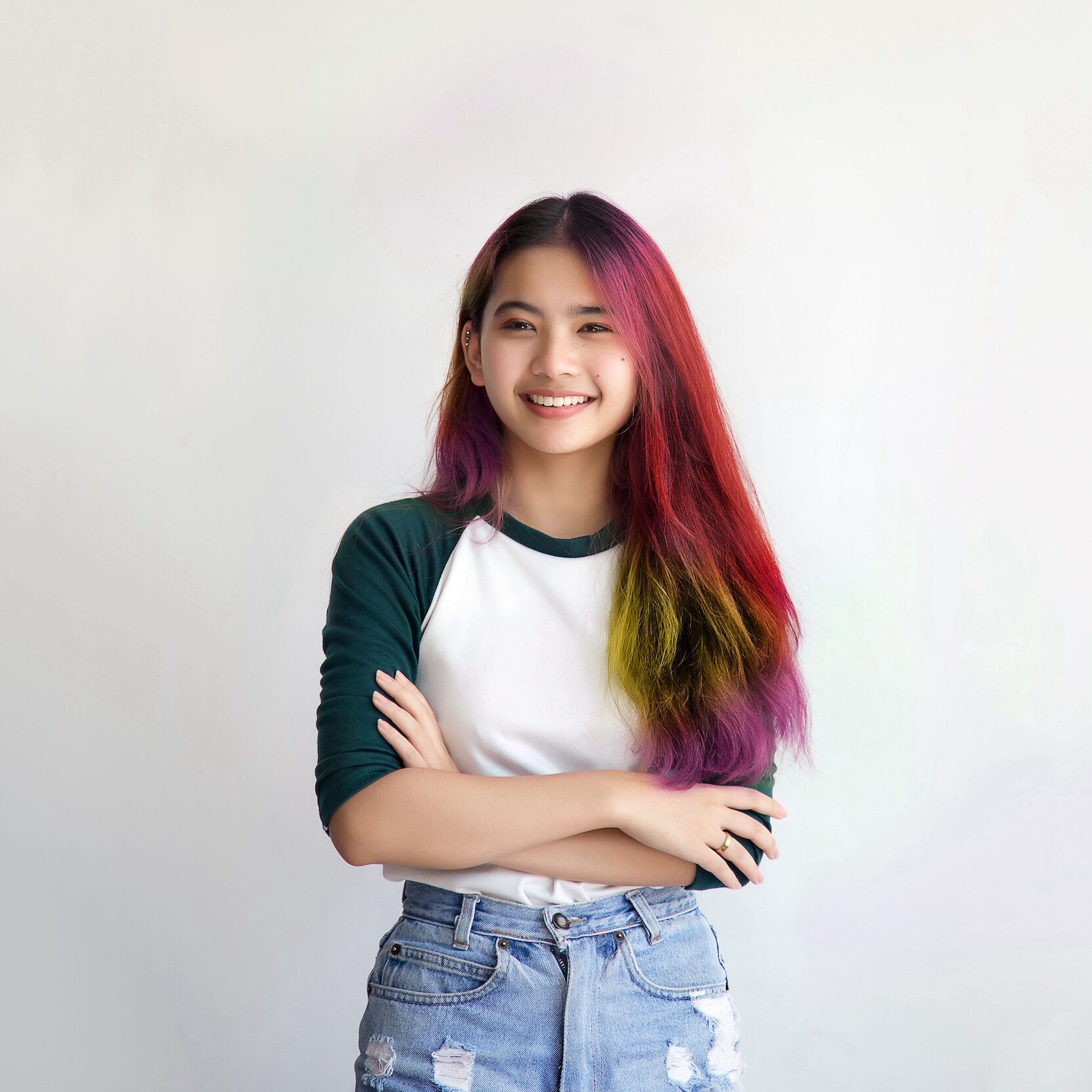 pretty asian femele smiling joyfully with colorful hair in dressed casually like hipster lifestyle, Independent fashion concept.